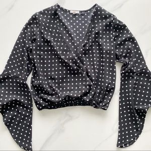 Polka dot black and white surplice blouse